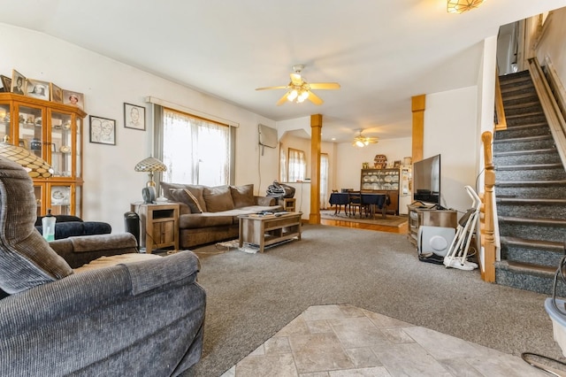 84-52 123rd St, Kew Gardens, NY 11415 - living room featuring a ceiling fan, stairs, and light carpet