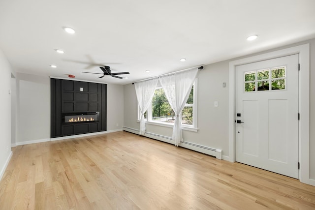 entryway featuring ceiling fan, light wood finished floors, plenty of natural light, and recessed lighting