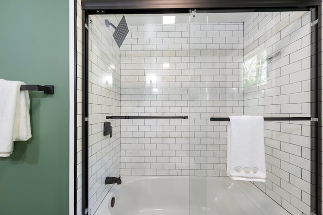 full bathroom with bath / shower combo with glass door