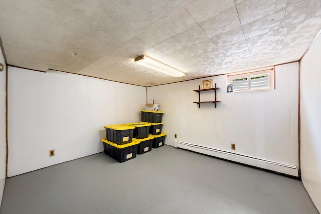 basement featuring a baseboard radiator