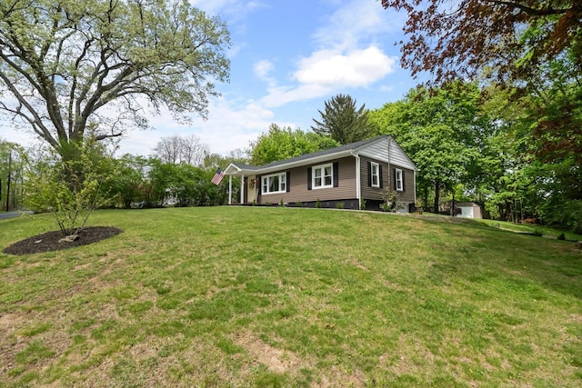 view of grassy yard with a storage shed and an outdoor structure