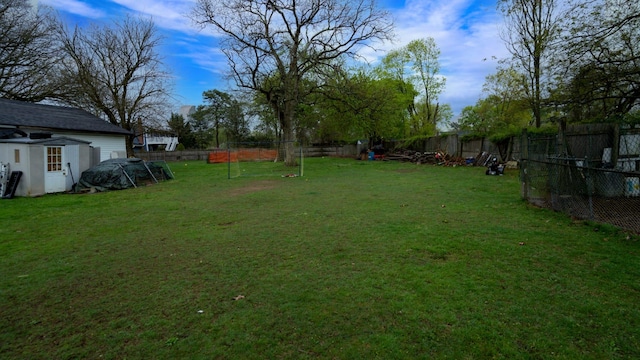 view of yard with a fenced backyard