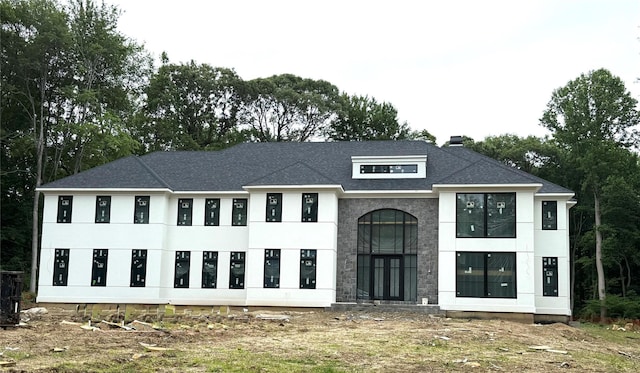 1629 Cedar Swamp Rd, Glen Head, NY 11545 - view of front of house featuring stucco siding, a shingled roof, and a chimney