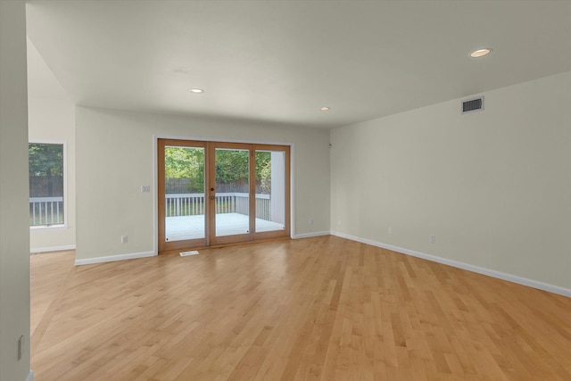 2 Heiko Ct, Northport, NY 11768 - empty room featuring french doors, light wood-style flooring, baseboards, and recessed lighting