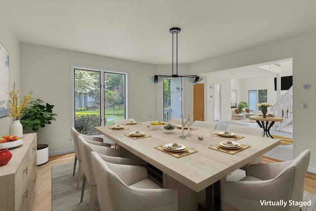 2 Heiko Ct, Northport, NY 11768 - dining room featuring plenty of natural light, light wood-style flooring, and baseboards