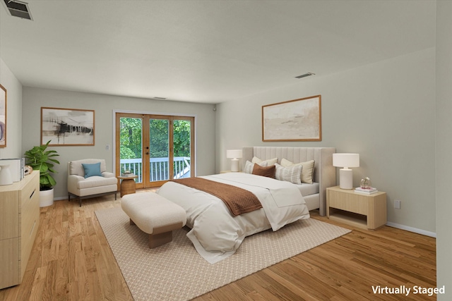 2 Heiko Ct, Northport, NY 11768 - bedroom with access to exterior, light wood-style flooring, and baseboards