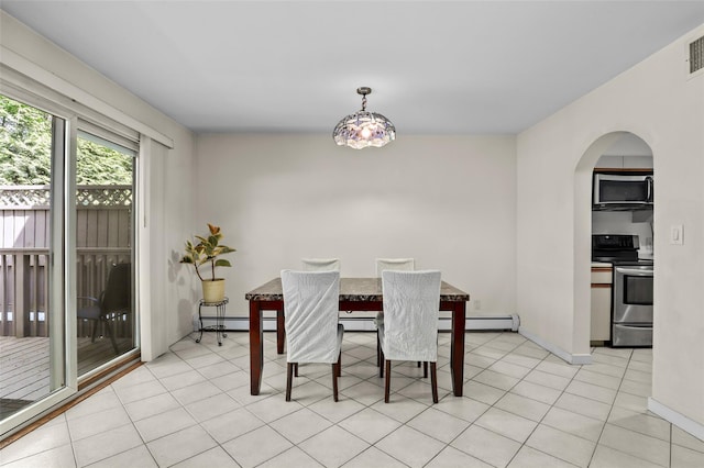 dining space with arched walkways, baseboards, and a baseboard heating unit