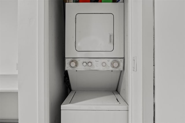 washroom with laundry area and stacked washing maching and dryer