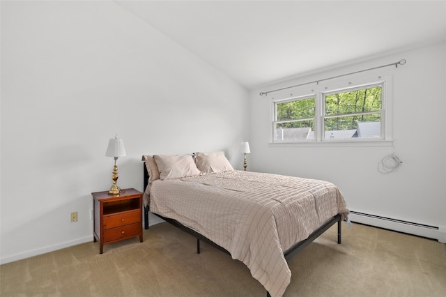 carpeted bedroom featuring baseboards, baseboard heating, and vaulted ceiling
