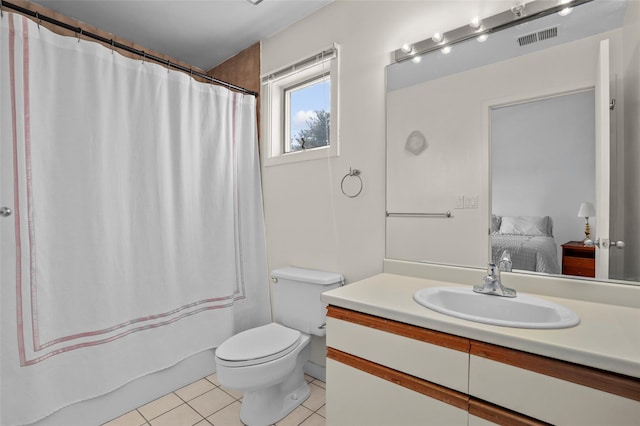 bathroom featuring vanity, visible vents, toilet, connected bathroom, and tile patterned floors