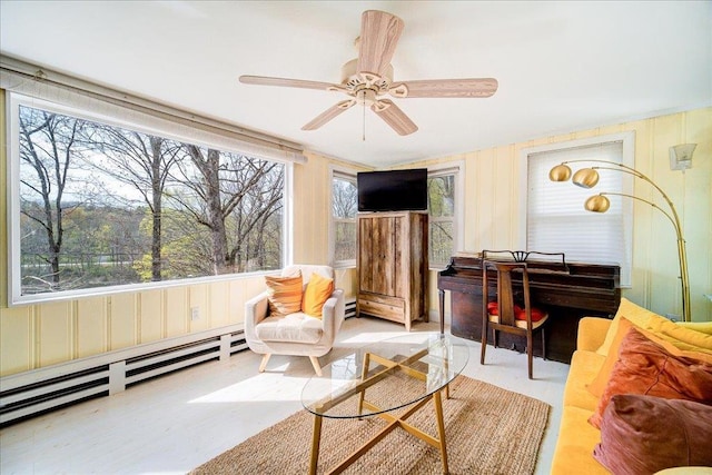 sitting room featuring a baseboard radiator, ceiling fan, and baseboard heating