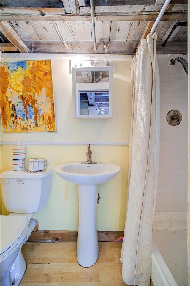 full bathroom with wood ceiling, toilet, and wood finished floors