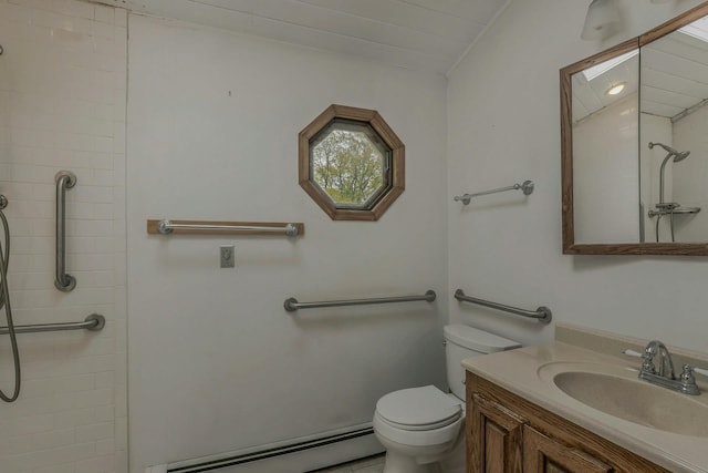 full bath featuring vanity, a baseboard heating unit, toilet, and tiled shower