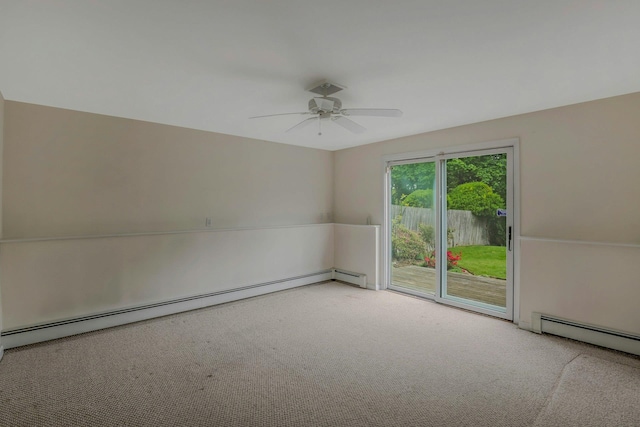 carpeted spare room with a baseboard radiator and a ceiling fan