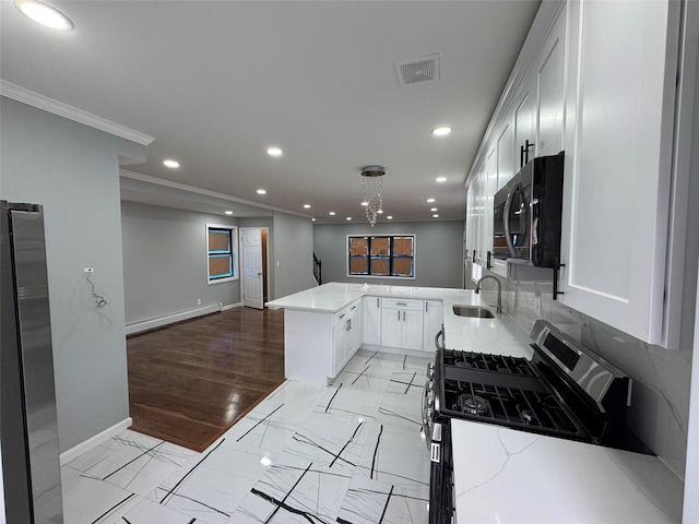 188-51 120th Rd, Saint Albans, NY 11412 - kitchen with stainless steel appliances, baseboard heating, recessed lighting, ornamental molding, and baseboards