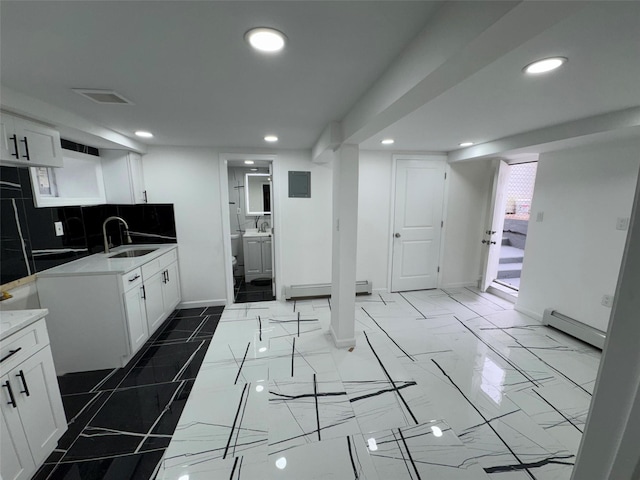 188-51 120th Rd, Saint Albans, NY 11412 - kitchen with a sink, recessed lighting, baseboards, white cabinetry, and a baseboard heating unit