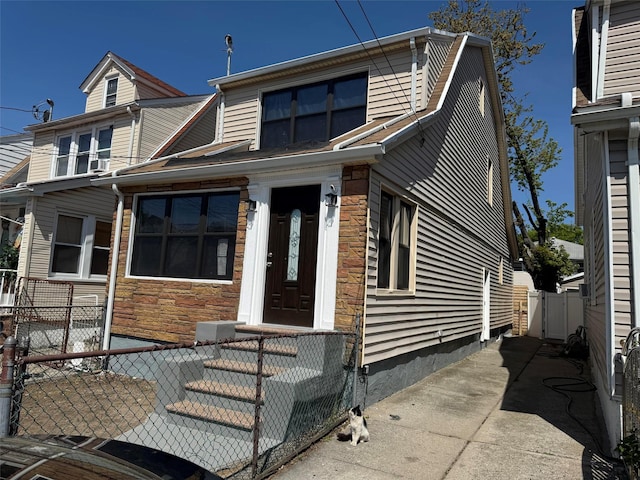 188-51 120th Rd, Saint Albans, NY 11412 - view of front of house with stone siding and a gate