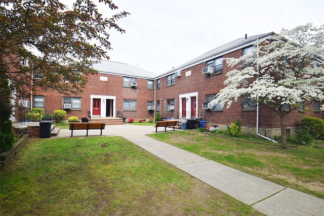 view of home's community with a yard