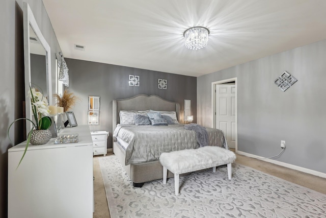 bedroom with carpet floors, a chandelier, and baseboards