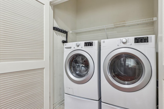washroom with washer and dryer