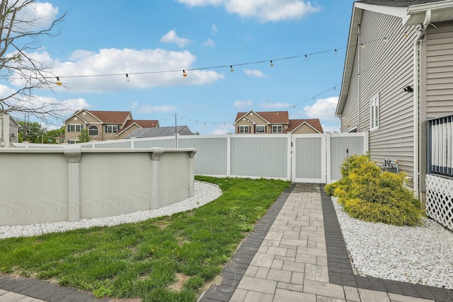 view of yard with a gate