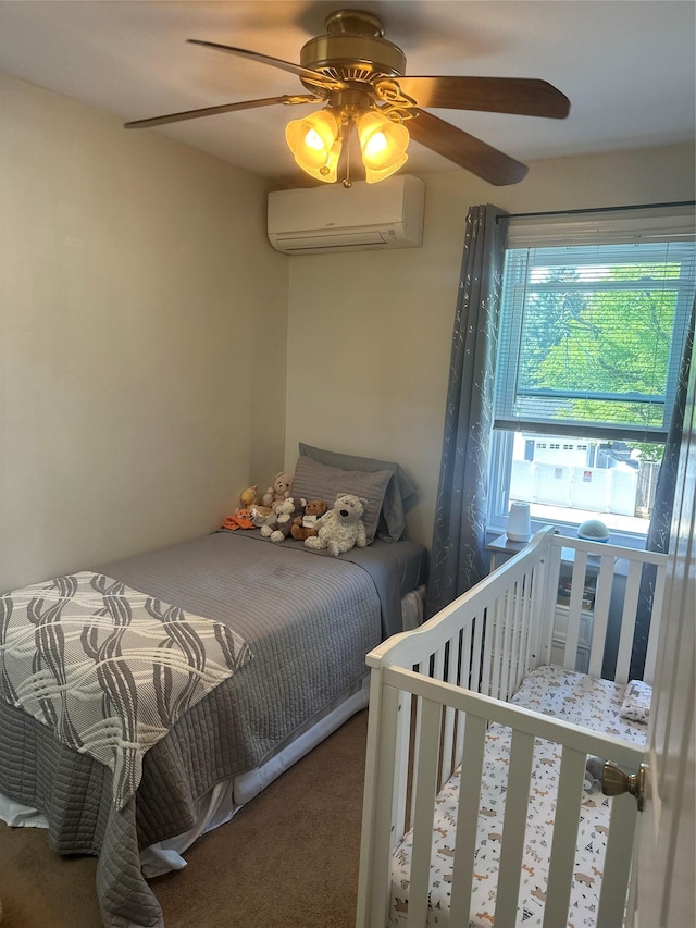 bedroom with carpet floors, ceiling fan, and a wall mounted AC