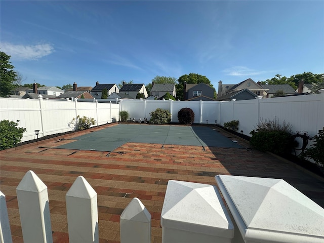 exterior space featuring a residential view and a fenced backyard