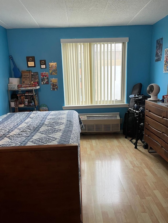 bedroom with wood finished floors