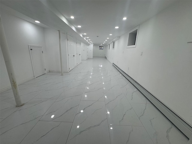 23-21 98th St, Flushing, NY 11369 - empty room with light marble finish floors, recessed lighting, a baseboard radiator, and baseboards