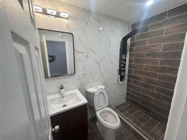 23-21 98th St, Flushing, NY 11369 - full bathroom with tile walls, vanity, a tile shower, and toilet