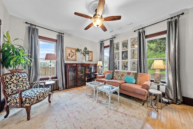 96 E Main St, Port Jervis, NY 12771 - living room featuring healthy amount of natural light, a ceiling fan, and wood-type flooring
