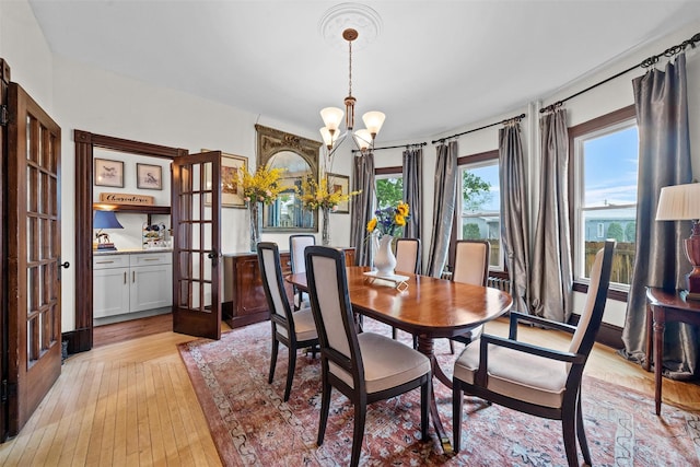 96 E Main St, Port Jervis, NY 12771 - dining space with a chandelier, french doors, and light wood-style floors