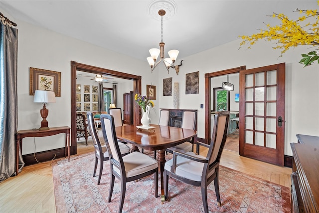 96 E Main St, Port Jervis, NY 12771 - dining room with a chandelier, light wood-type flooring, plenty of natural light, and baseboards