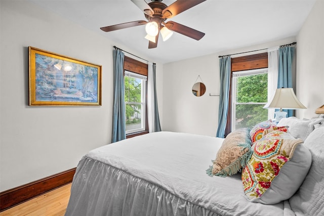 96 E Main St, Port Jervis, NY 12771 - bedroom with multiple windows, wood finished floors, baseboards, and ceiling fan