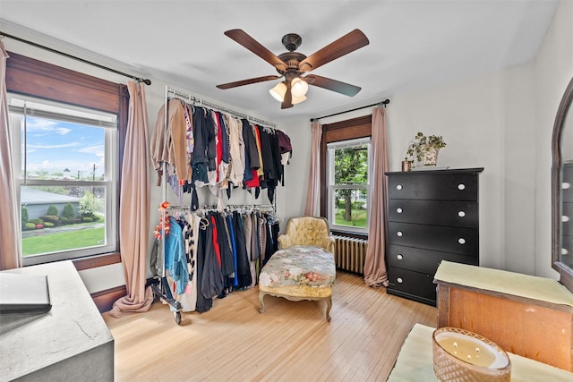 96 E Main St, Port Jervis, NY 12771 - bedroom featuring wood-type flooring, a ceiling fan, and radiator