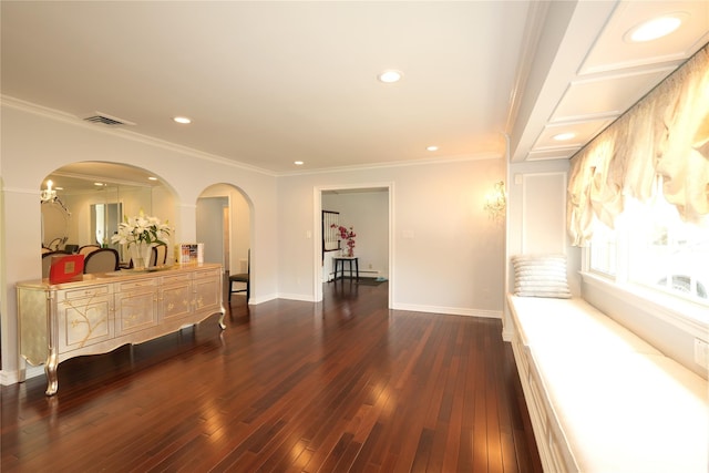 corridor featuring arched walkways, recessed lighting, baseboards, visible vents, and dark wood-style floors