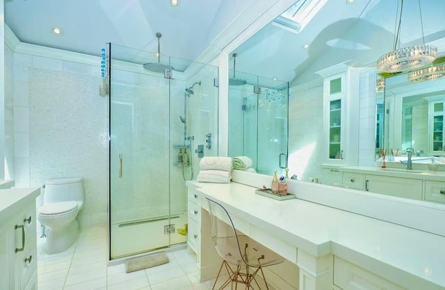 bathroom with vanity, tile patterned floors, and a stall shower