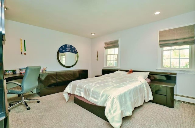 bedroom featuring carpet floors, recessed lighting, and a baseboard heating unit