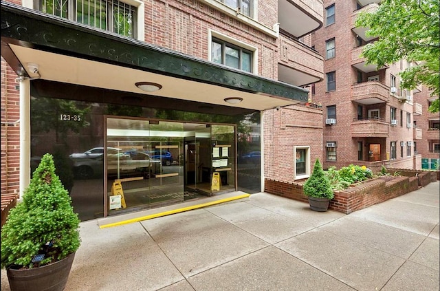 entrance to property with brick siding