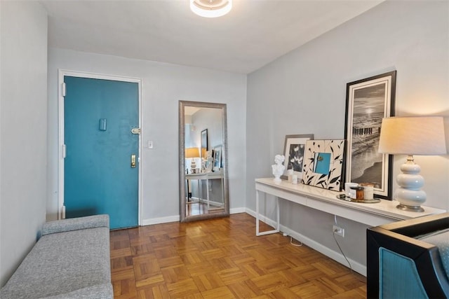 foyer featuring baseboards
