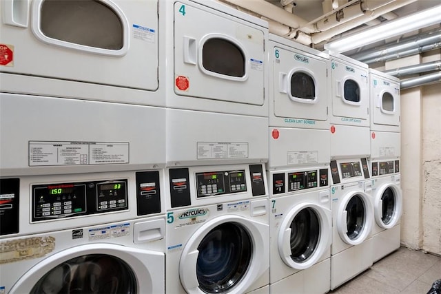 shared laundry area with tile patterned floors, stacked washer / drying machine, and independent washer and dryer