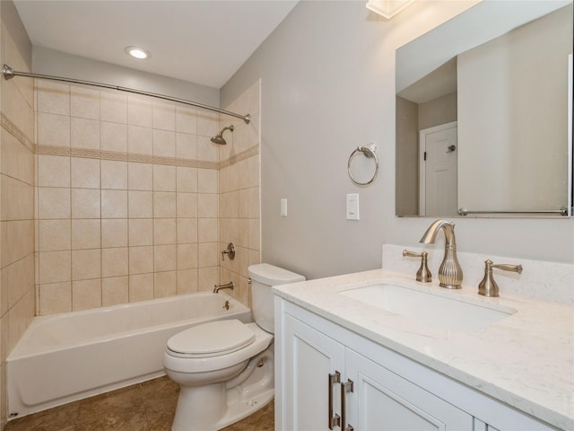 bathroom with toilet, vanity, and shower / bathtub combination
