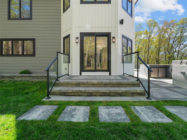 5 N Hills Rd, East Norwich, NY 11732 - property entrance with board and batten siding and a yard