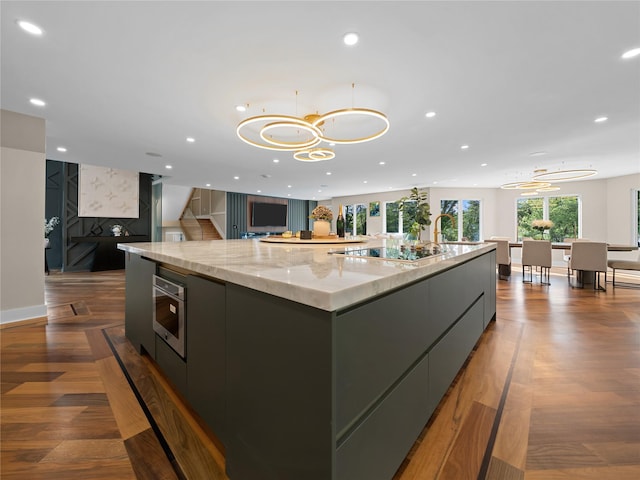 5 N Hills Rd, East Norwich, NY 11732 - kitchen featuring modern cabinets, a large island, open floor plan, recessed lighting, and a chandelier