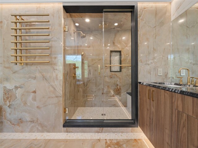 5 N Hills Rd, East Norwich, NY 11732 - bathroom featuring vanity, a marble finish shower, and tile walls