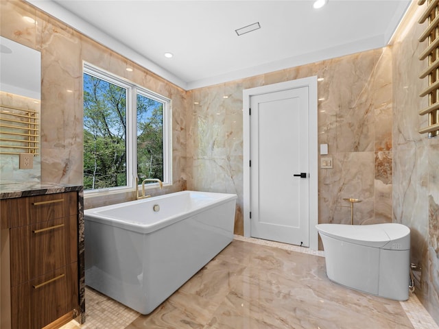 5 N Hills Rd, East Norwich, NY 11732 - full bath featuring tile walls, a freestanding bath, vanity, a towel warmer, and marble tiled floors