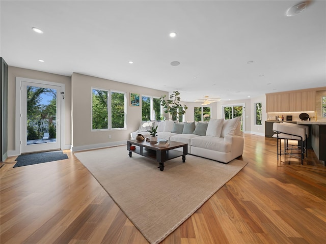 5 N Hills Rd, East Norwich, NY 11732 - living area featuring baseboards, light wood-type flooring, and recessed lighting
