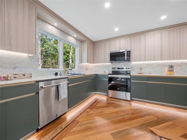 5 N Hills Rd, East Norwich, NY 11732 - kitchen featuring appliances with stainless steel finishes, gray cabinetry, a sink, tasteful backsplash, and light countertops