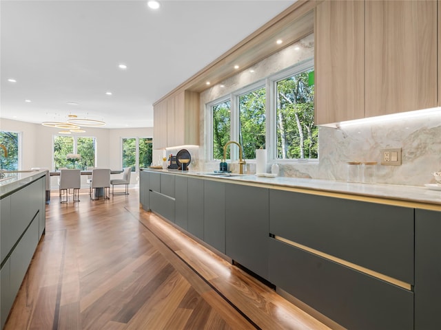 5 N Hills Rd, East Norwich, NY 11732 - kitchen featuring modern cabinets, gray cabinets, plenty of natural light, backsplash, and recessed lighting