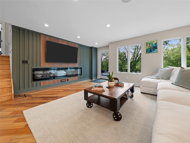 5 N Hills Rd, East Norwich, NY 11732 - living area featuring wood finished floors, recessed lighting, and a glass covered fireplace